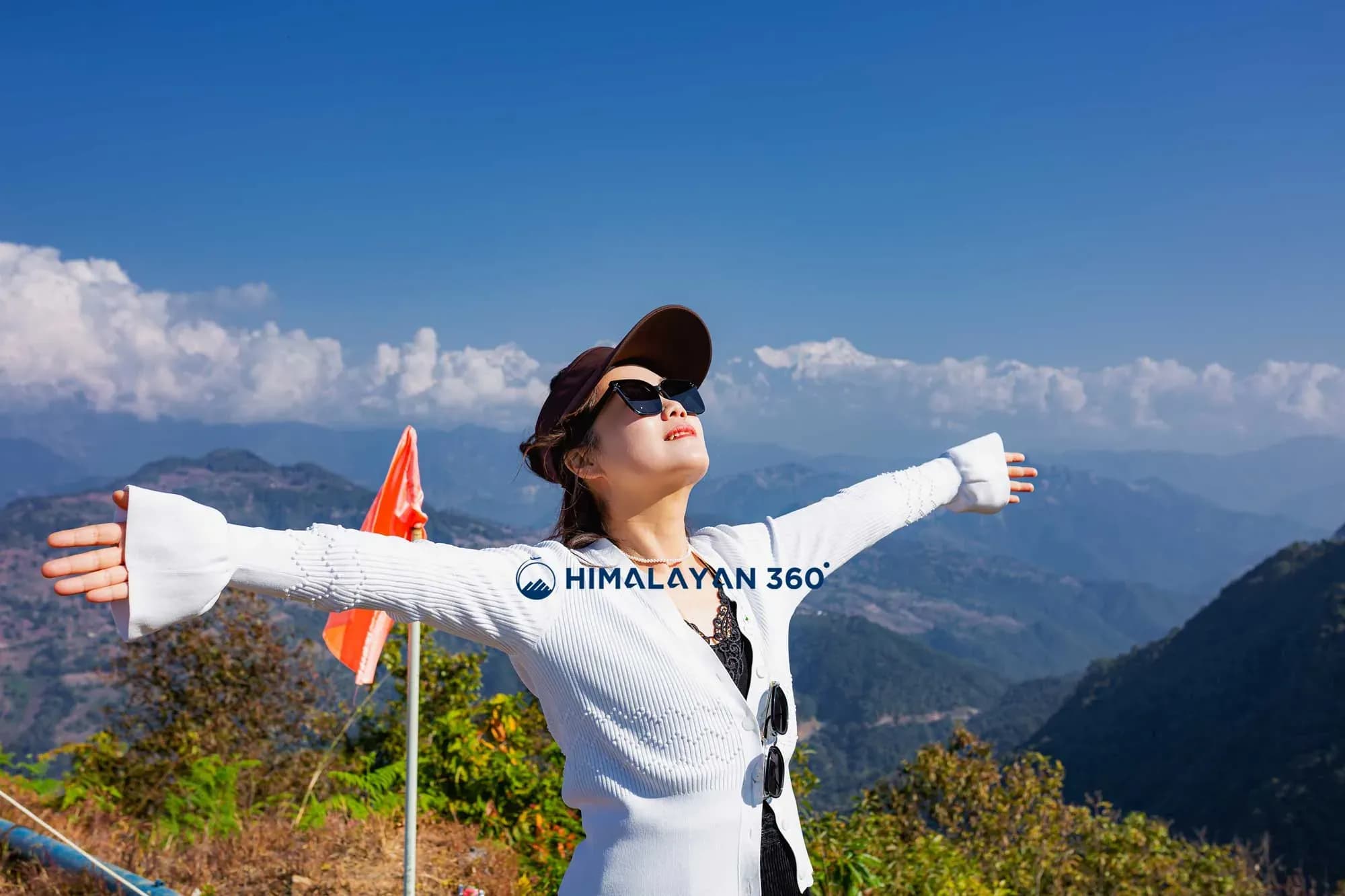 Arms open to the mountains on the yoga and meditation trek