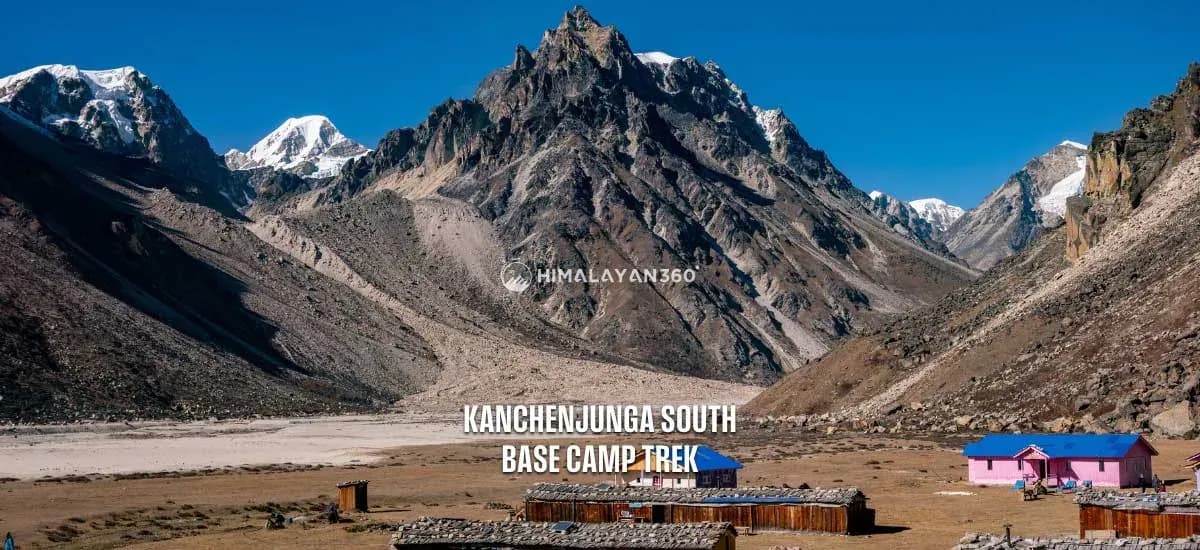 Local Traditional teahouse with a colorful rooftop along the Kanchenjunga South Base Camp Trek, with Mount Kanchenjunga with snow in the background.