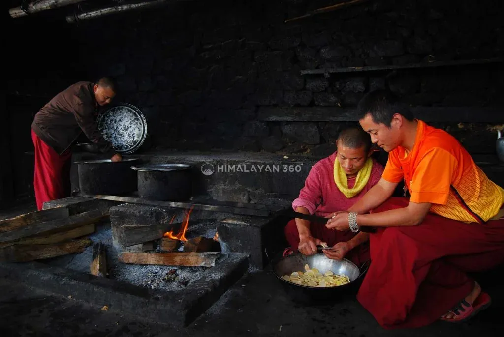 Monk cooking in Monastery in Bhutan