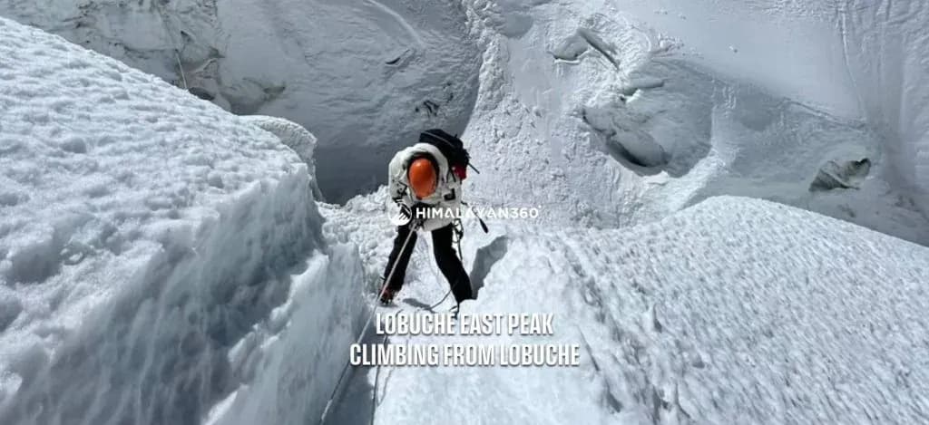 A person on Snowcapped Lobuche Peak