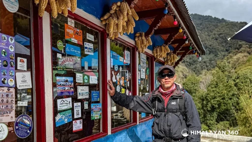 During the Poon hill ghandruk yoga trek trekkers taking photos in infront of local guest house