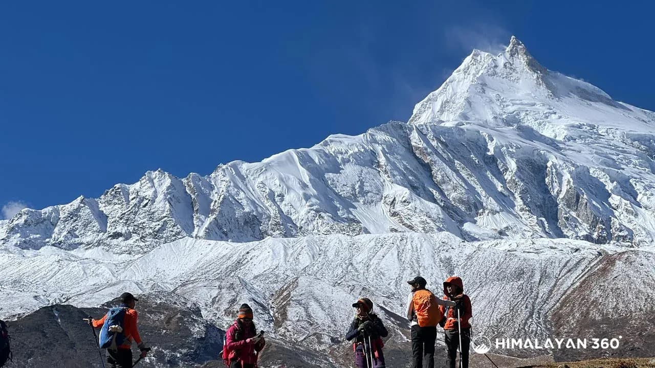 Trekkers are enjoing the photography moment Infront of Mount Manaslu during the Manaslu Circuit trek.